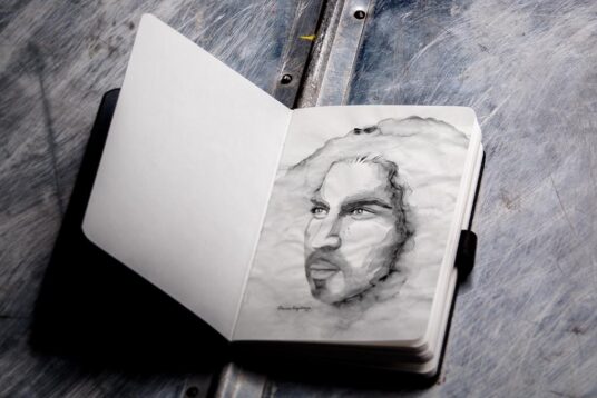 Free Photorealistic Sketchbook Mockup
