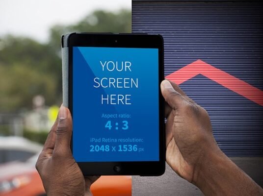 Hands holding iPad mockup