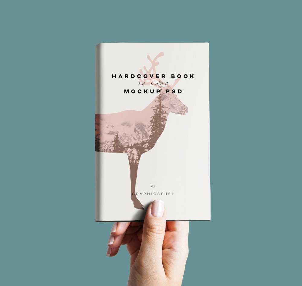 Hardcover Book in Hand Free PSD mockup